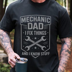 May include: A white ceramic mug with a black handle and the text "But First, Coffee" in a black, bold font. The mug is on a white surface.