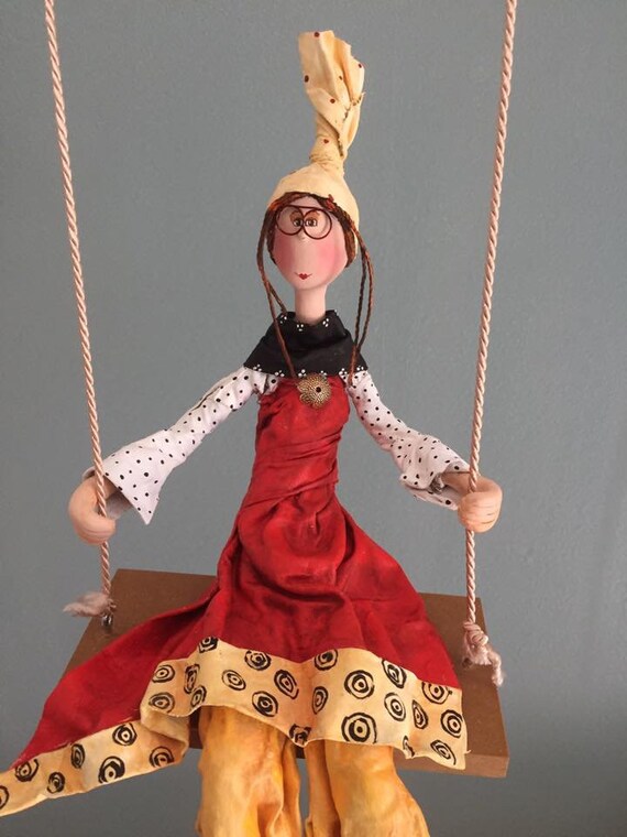 doll on a swing