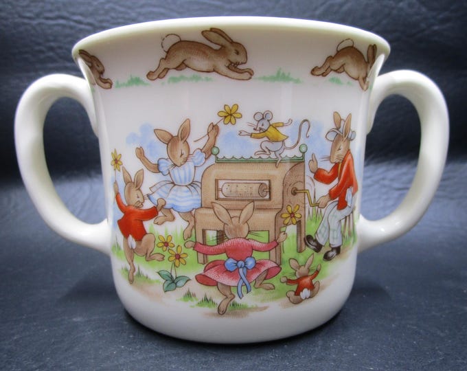 Featured listing image: Royal Doulton Bunnykins Mug Golden Jubilee Celebration Double Handled Bunnies Playing Piano Barbara Vernon Walter Hayward Artwork