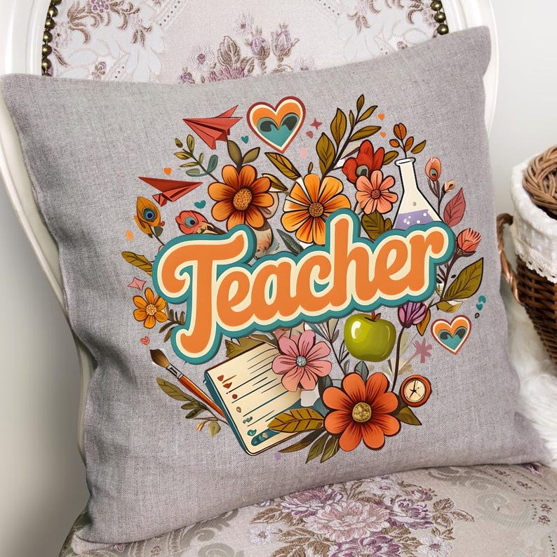 May include: Gray square throw pillow with a colorful floral design and the word "Teacher" in orange and teal. The design includes flowers, a green apple, a notebook, and a science beaker.