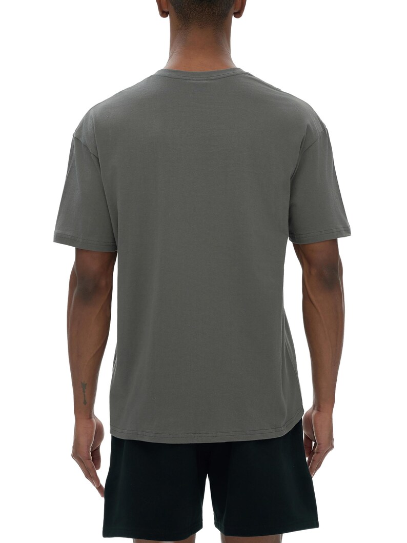 May include: A gray t-shirt with a crew neck and short sleeves. The shirt is made of a soft material and is shown from the back. The model is wearing black shorts. The background is white.