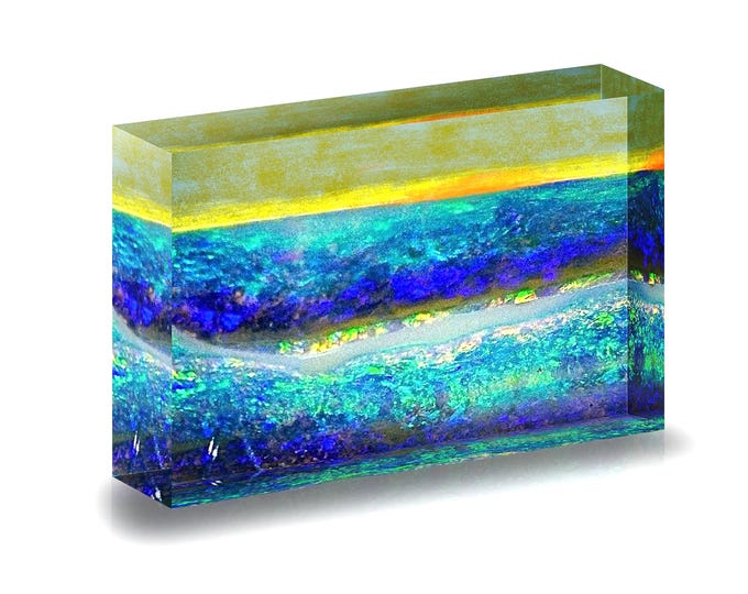 Print of Australian Boulder Opal displayed in acrylic block.