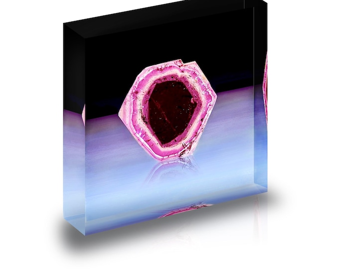 Print of  a Madagascar Tourmaline slice displayed in acrylic block.