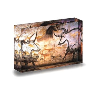 Print of Prehistoric Lascaux Cave paintings, France, displayed in acrylic block.