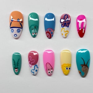 Bikini bottom inspired press on nails with detailed nail art, application pack included
