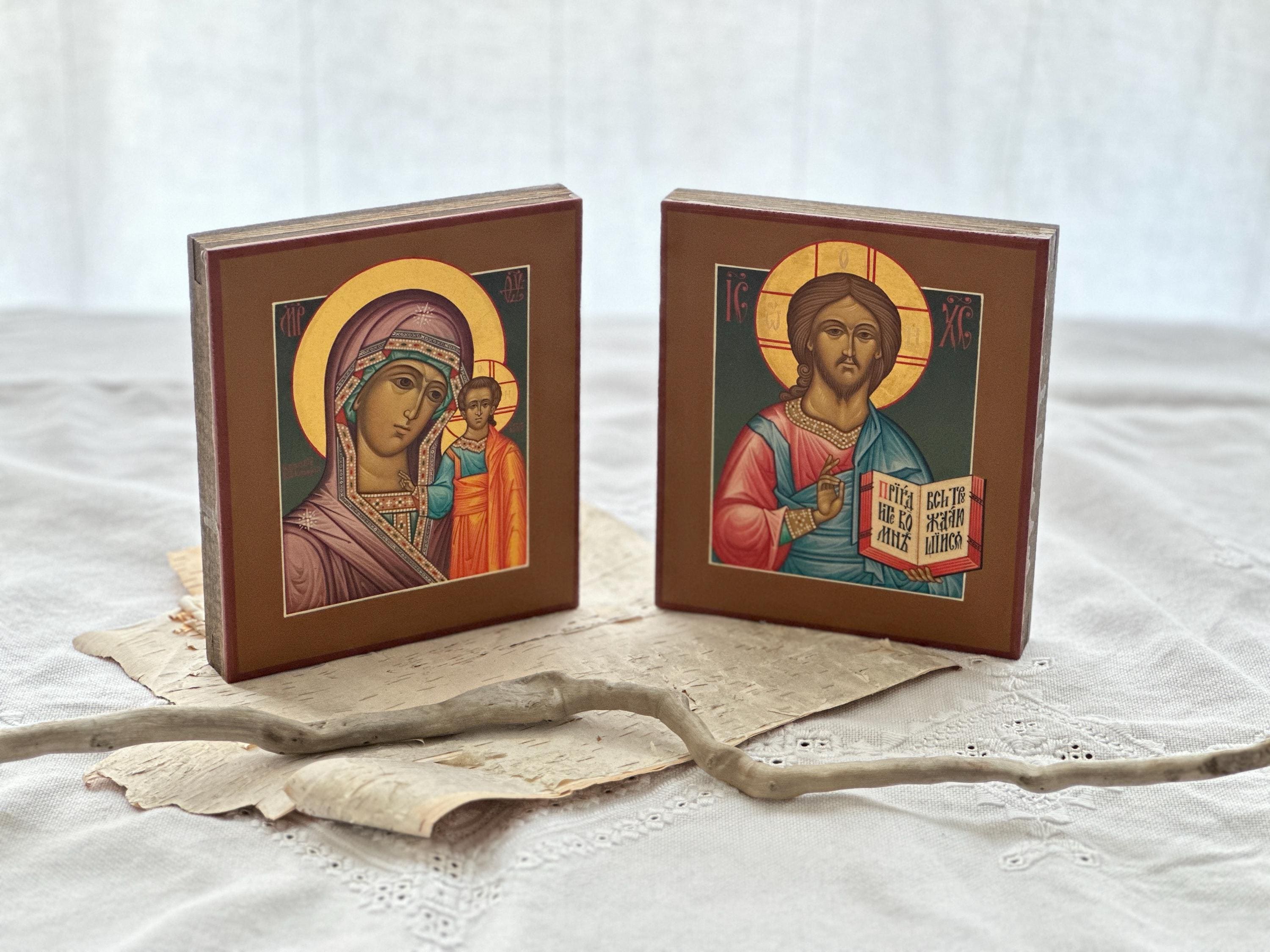 A pair of hand painted icons of Mother of God “Kazanskaya” and the Savior on wooden boards