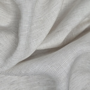 High-quality linen fabric striped in white beige