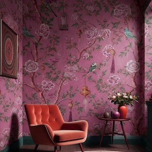 May include: A room with a vibrant pink floral wallpaper featuring birds and flowers. An orange velvet armchair sits in the corner, complemented by a small side table and a red rug. The room has a cozy and elegant atmosphere.
