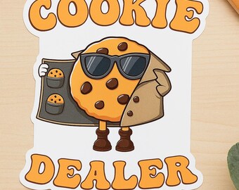 May include: A sticker featuring a cartoon cookie character wearing sunglasses and a trench coat, holding a tray of cookies. The words "COOKIE DEALER" are written in orange bubble letters.