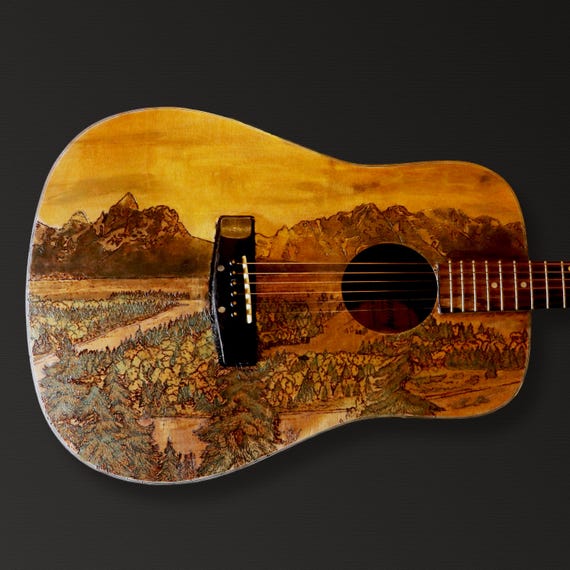 Custom Wood-burned Guitar Art: Personalized Designs for Your