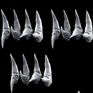 May include: A collection of gray, claw-like fantasy miniatures. The claws have a sharp, pointed tip and a textured base with small holes and bumps. The words "Grimdark fantasy" and "Leech Lover Laboratory" are also visible.