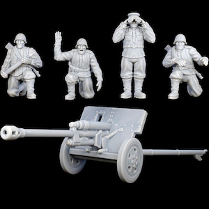May include: A gray plastic model of a World War I era artillery gun with four gray plastic figures of soldiers. The gun is on wheels and has a barrel pointing to the left. The soldiers are in various poses, including standing, kneeling, and aiming.