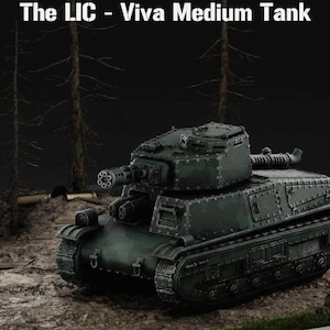 May include: A dark green model tank with a multi-barreled gun and the text "The LIC - Viva Medium Tank". The tank is set on a diorama with miniature trees and a dirt ground.