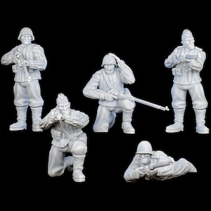 May include: Five gray miniature soldier figurines in various action poses. The soldiers wear helmets and uniforms, holding rifles and other equipment. The figures are set against a black background.