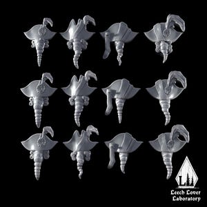 May include: A collection of twelve gray, ornate, stylized objects, each with a unique design featuring a feathered element, swirling details, and a tapered base. The objects are arranged against a black background.