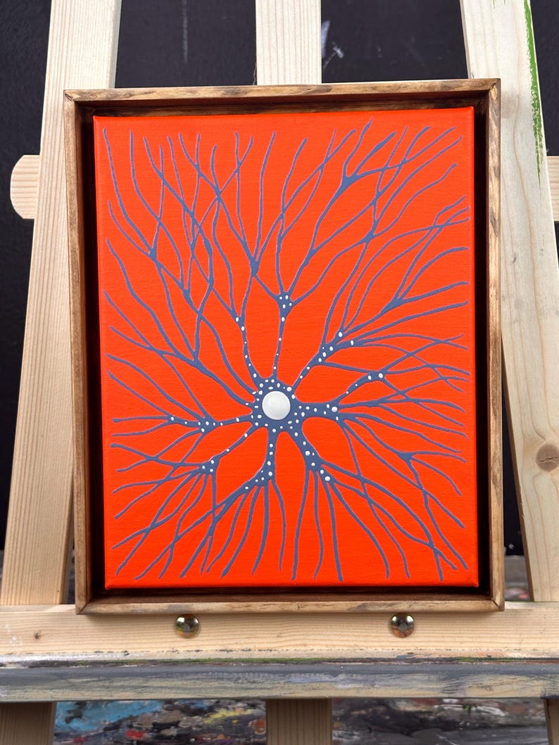 May include: A framed painting of a stylized neuron with a white circle in the center and blue branches on an orange background.