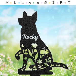 May include: Black metal dog silhouette garden stake with the name "Rocky" in white script. The dog shape is filled with floral cutouts. The top of the image has the text "H • L • L • y • a • G • I • F • T".