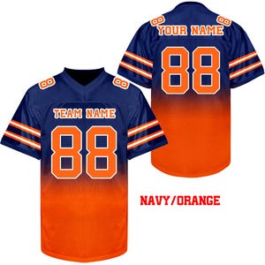 May include: Navy blue and orange sublimated football jersey with white numbers and stripes. The jersey has "TEAM NAME" and "88" on the front and "YOUR NAME" and "88" on the back.