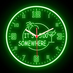 May include: Green neon clock with a palm tree and cocktail glass design. The clock face reads "It's 5:00 Somewhere".