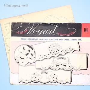 May include: A vintage Vogart transfer pattern booklet with the number 107 on the cover. The booklet contains three heirloom patterns for cases, sheets, and other items. The patterns are for embroidery and feature floral designs.