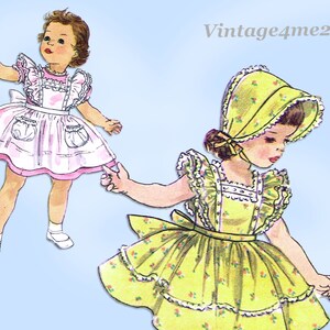 May include: Vintage illustration of two girls wearing matching dresses with ruffled collars and aprons. The girl on the left is wearing a pink dress with white accents, while the girl on the right is wearing a yellow dress with floral print. Both girls are wearing white socks and shoes.