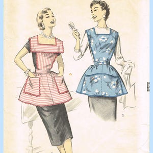 May include: An Advance 8163 sewing pattern envelope for medium-sized aprons. The illustration shows two apron styles: one with pink and white horizontal stripes and scalloped trim, and another in blue with a white floral print and square neckline.