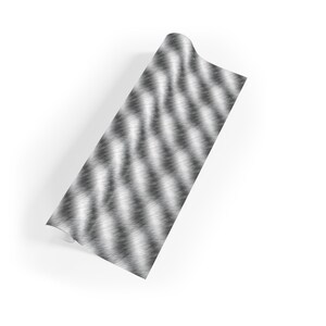 May include: A roll of silver and black patterned wrapping paper with a brushed metal effect.