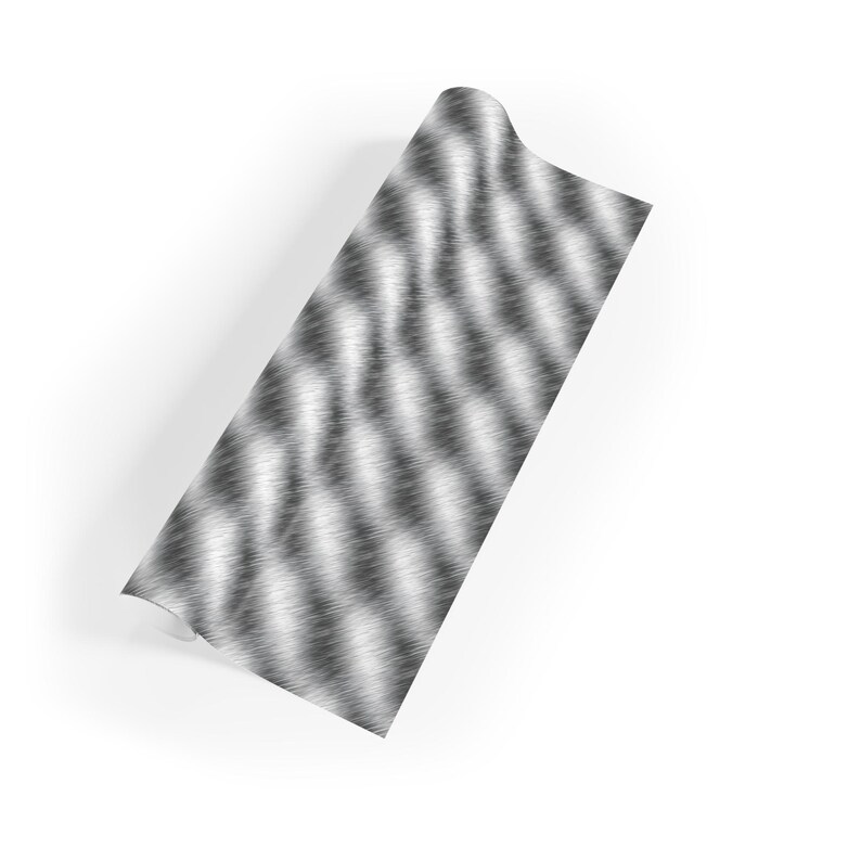 May include: A roll of silver and black patterned wrapping paper with a brushed metal effect.