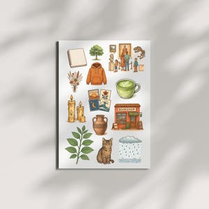 Puede incluir: Ilustración con varios objetos: un cuaderno, un árbol, una sudadera con capucha, flores secas, velas, tarjetas, una taza de matcha, un jarrón, un gato, una nube de lluvia y una librería. Paleta de colores cálidos.