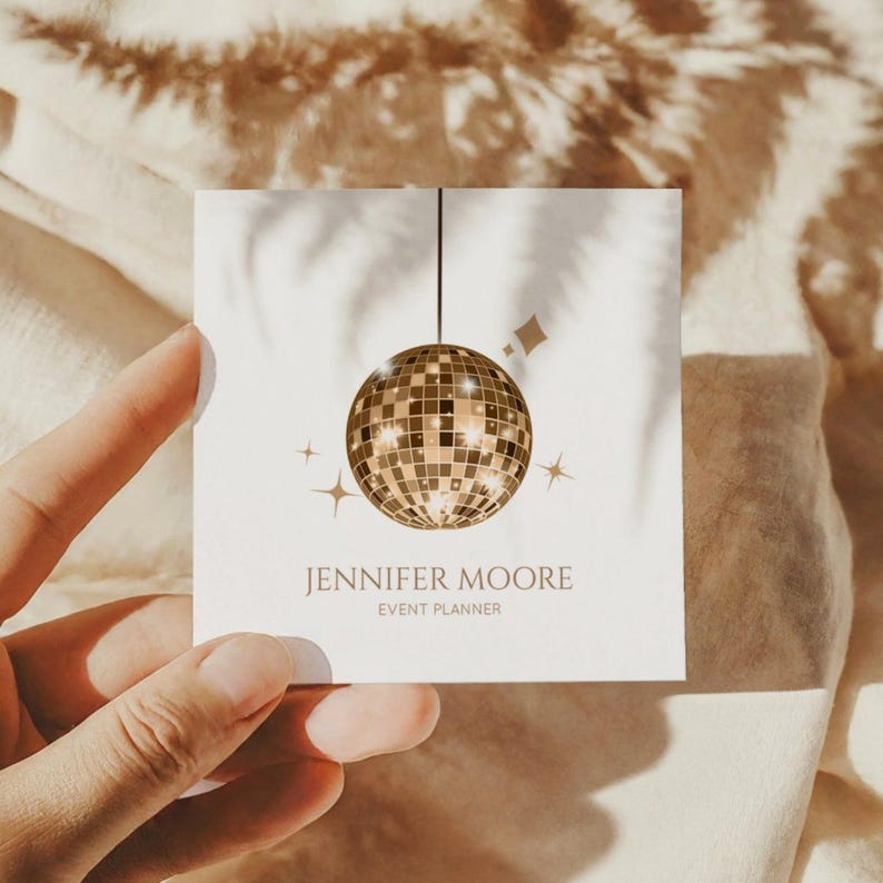 May include: Square business card with a gold disco ball illustration and star accents. The card displays the text "JENNIFER MOORE" and "EVENT PLANNER". The card is held by a hand. The overall design has a party theme.