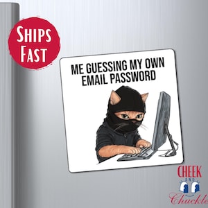 May include: A white magnet with a cartoon cat wearing a black ski mask and holding a computer mouse. The text on the magnet reads "Me guessing my own email password".