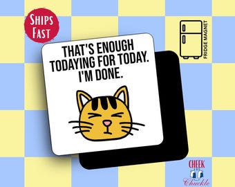 May include: A white fridge magnet with the text "THAT'S ENOUGH TODAYING FOR TODAY. I'M DONE." features a cartoon cat face. The magnet has a black backing and a small illustration of a refrigerator. The background is a checkered pattern.