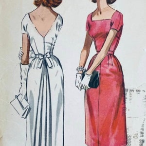 May include: Vintage sewing pattern illustration of two dresses. One dress is white with a bow at the waist and the other is pink with a square neckline. The pattern is for McCall's and is designed exclusively for McCall's.