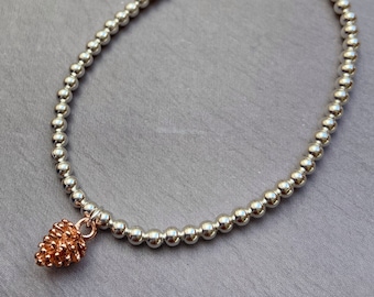 Rose gold fir cone charm bracelet