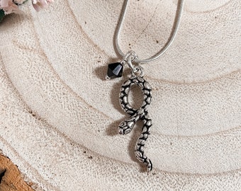 Serpent charm necklace