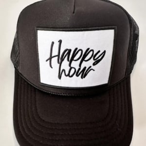 May include: Black trucker hat with a white square patch that says "Happy Hour" in black cursive writing.