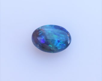 Australian Black Opal Oval, .69 Carat Oval Opal from Corcoran Field, Lightening Ridge, Australia, 7.24 x 5.19mm, Broad Flash Opal