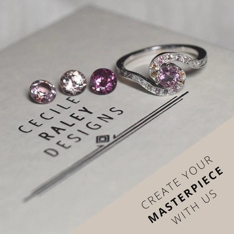 May include: A silver ring featuring a central pink gemstone surrounded by smaller accent stones, accompanied by three loose round-cut gemstones in shades of pink and peach. The text CECILE RALEY DESIGNS and CREATE YOUR MASTERPIECE WITH US is visible.