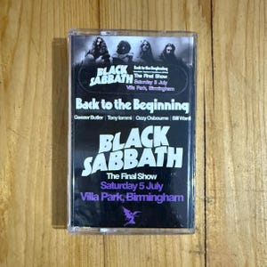 May include: A Black Sabbath cassette tape with the band's name in white lettering. The cover includes the text "The Final Show" and "Saturday 5 July Villa Park, Birmingham." The cassette is housed in a clear plastic case.