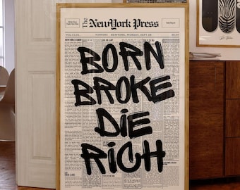 May include: A framed wall art print featuring a vintage newspaper layout titled The New York Press. The center displays the bold, black, hand-painted text BORN BROKE DIE RICH over columns of small, illegible newsprint text on a cream background.