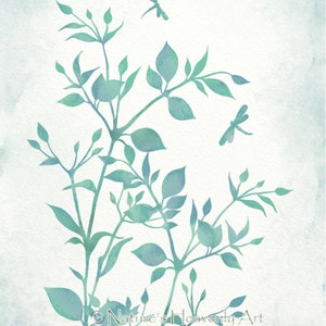 May include: Watercolor painting of a leafy branch with two dragonflies in flight. The background is a light blue watercolor wash. The painting is signed "Nature's Heavenly Art".