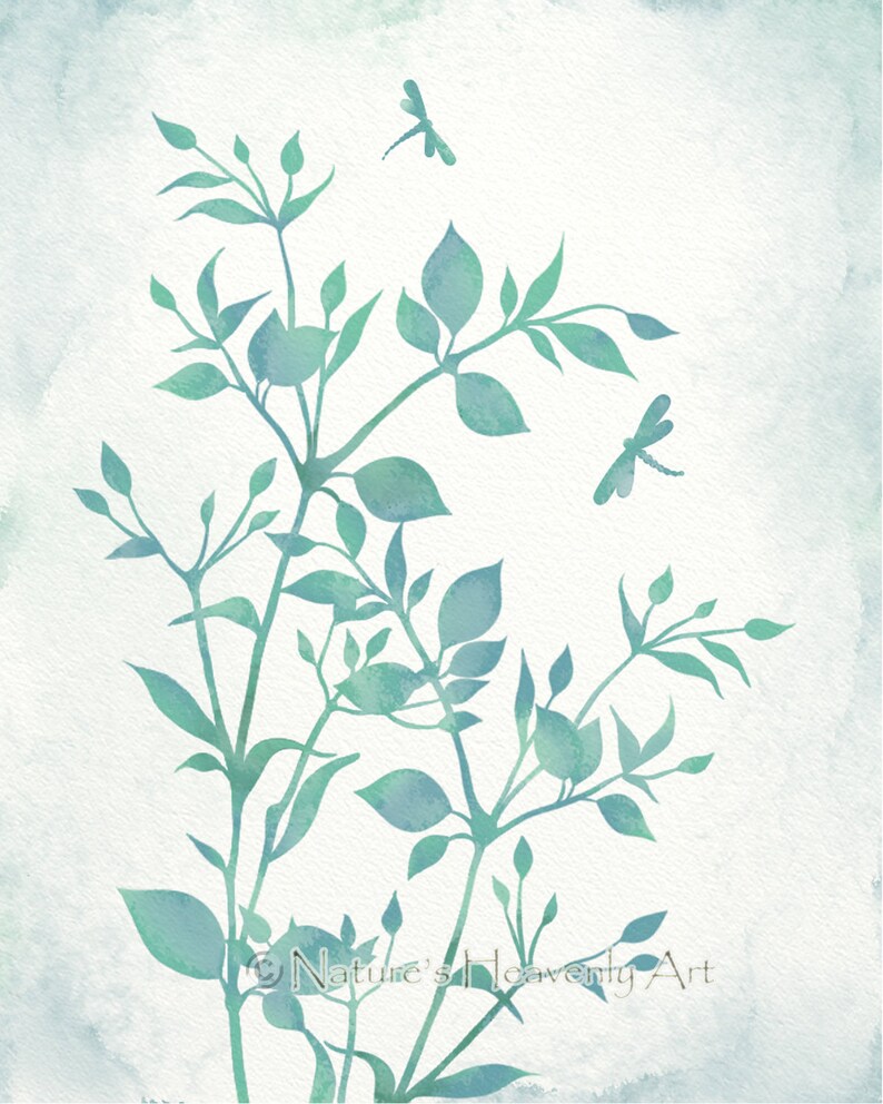 May include: Watercolor painting of a leafy branch with two dragonflies in flight. The background is a light blue watercolor wash. The painting is signed "Nature's Heavenly Art".