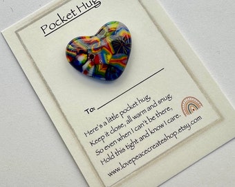 May include: A small, colorful glass heart with a "Pocket Hug" card. The card says "Here's a little pocket hug, Keep it close, all warm and snug. So even when I can't be there, Hold this tight and know I care. www.lovepeacecreateshop.etsy.com"