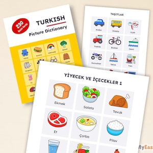 May include: A stack of educational materials, including a Turkish Picture Dictionary and flashcards. The dictionary is yellow and red, with the title "TURKISH Picture Dictionary". The flashcards feature illustrations of food, vehicles, and other basic words.