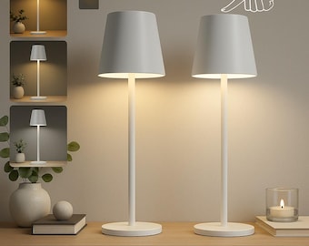 May include: Two white table lamps with conical shades and cylindrical bases are displayed on a wooden surface. The lamps are illuminated, showcasing a warm glow. The text "STEPLESS DIMMING" is at the bottom of the image. A hand graphic indicates touch control.
