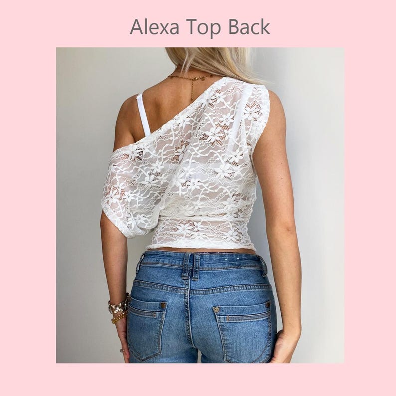 May include: White lace one-shoulder top with a floral pattern. The top is paired with blue denim jeans. The text "Alexa Top Back" is visible at the top of the image.