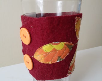 Upcycled eco friendly felted sweater cup cozy red with branch and appliqued leaves