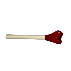 May include: A long, cylindrical tool with a smooth, cream-colored handle that transitions into a bulbous, glossy red head. The head features a distinct three-lobed shape, resembling a stylized garlic bulb or a rounded, multi-faceted tip.