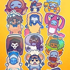 May include: A collection of twelve colourful vinyl stickers featuring stylised cartoon characters and objects, including a skateboard, a character labelled Echo, and various figures in costumes, all arranged on a solid yellow background.