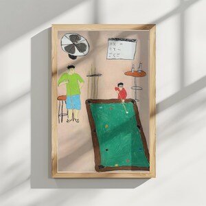 May include: A hand-drawn illustration of two people playing snooker. The snooker table is green with brown felt edges. The people are wearing casual clothing. The illustration is framed in a light wood frame.